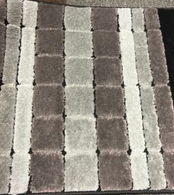 decorative carpet in shades of gray and black